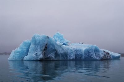 Scenic view of frozen sea against sky