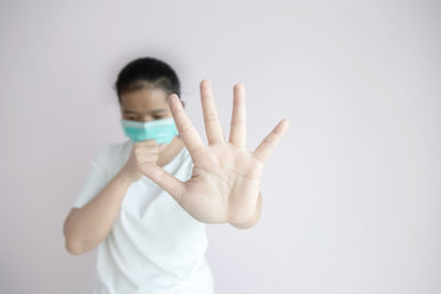 Portrait of boy against white background