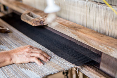 High angle view of hands working on factory