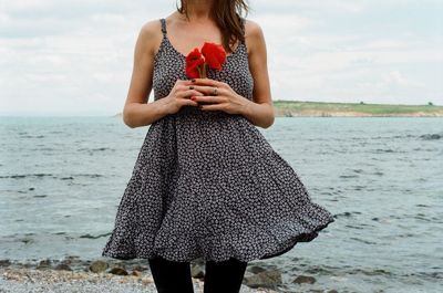 Woman standing on beach