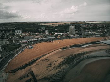 High angle view of city buildings against sky