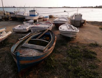 Boats moored on sea against sky