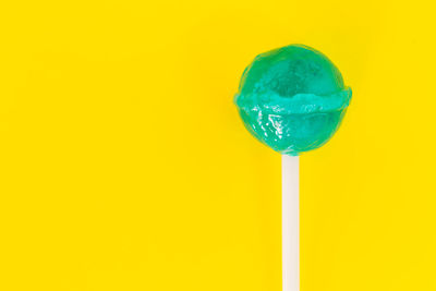 Close-up of ice cream against yellow background