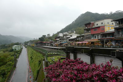 View of town against cloudy sky