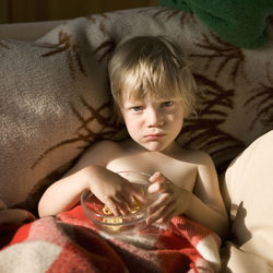 Boy eating snacks, sweden