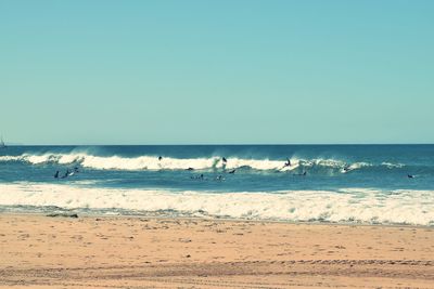 Scenic view of beach against clear sky