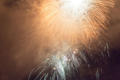 Low angle view of fireworks in sky