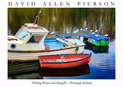 Fishing boats moored at lake