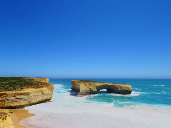 Scenic view of sea against clear blue sky