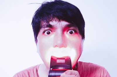 Portrait of mature man against white background