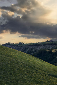 Scenic view of field against sky during sunset