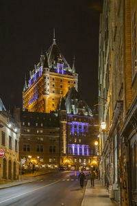 Illuminated buildings in city at night