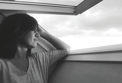 Woman looking at window