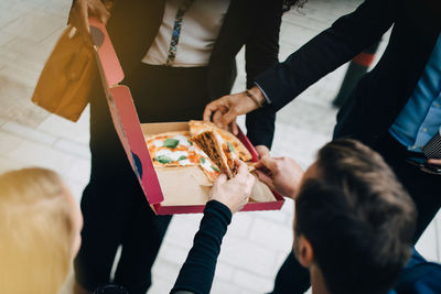 High angle view of people holding hands