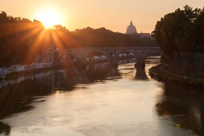 Sun shining over river