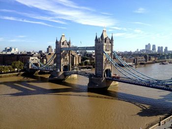 View of bridge over river in city