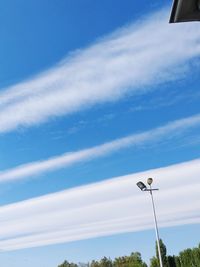 Low angle view of street light against sky