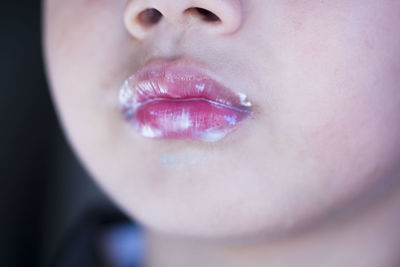 Close-up of ice cream on boy's mouth