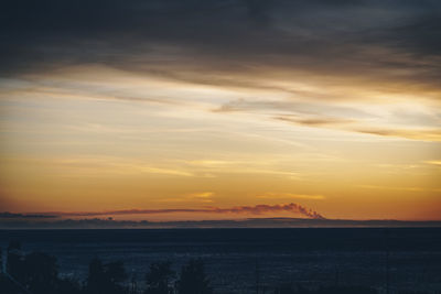 Scenic view of silhouette landscape against romantic sky at sunset