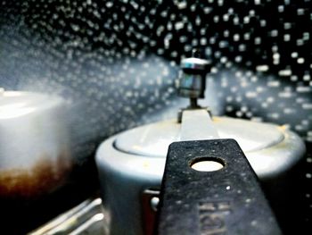 Close-up of water drops on metal