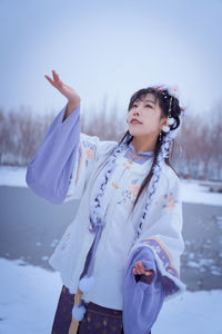 A girl in hanfu in the snow