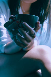 Close-up of woman hand holding drink