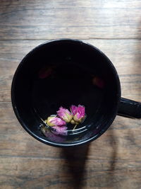 High angle view of rose in bowl on table