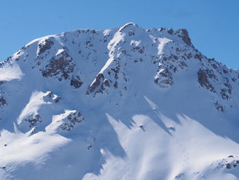 Snow covered mountain against sky