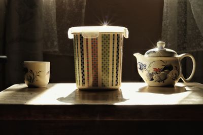 Close-up of coffee cup on table