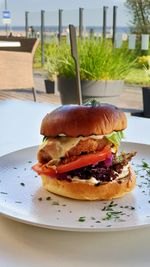 Close-up of burger in plate on table