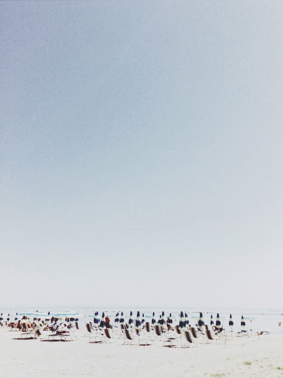 GROUP OF PEOPLE ON SANDY BEACH