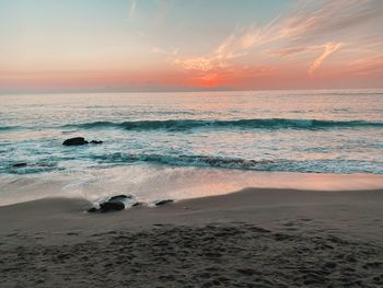 Scenic view of sea against sky during sunset