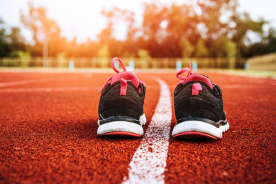 Close-up of shoes on sports track