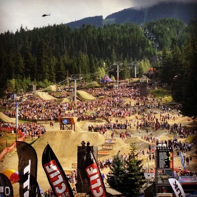 large group of people, tree, person, lifestyles, crowd, men, high angle view, mixed age range, leisure activity, built structure, building exterior, architecture, outdoors, tourist, sky, tourism, mountain, vacations