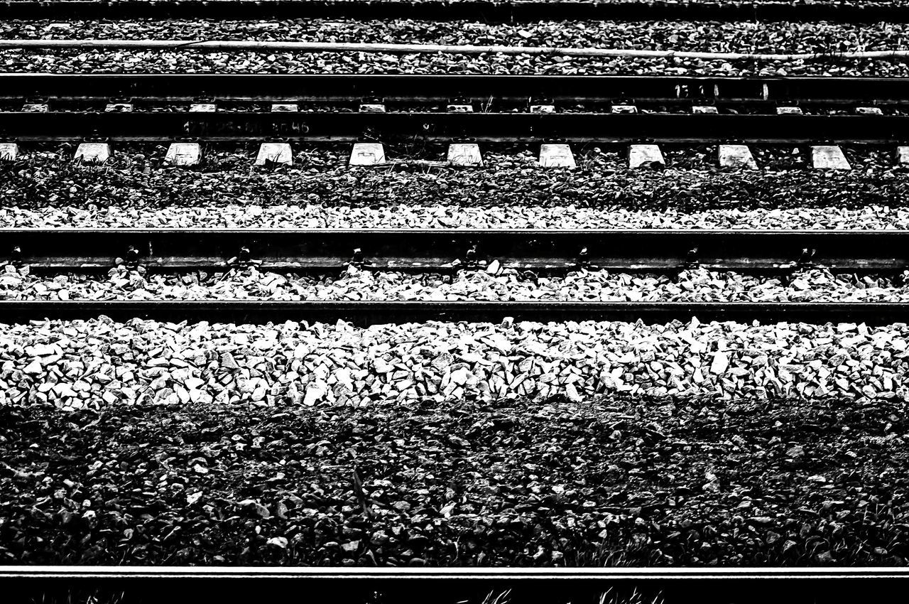 railroad track, rail transportation, high angle view, metal, transportation, backgrounds, public transportation, full frame, railroad station platform, pattern, railing, railway track, no people, day, outdoors, railroad station, abundance, connection, field