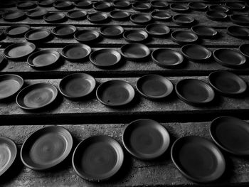 High angle view of plates on tables in workshop