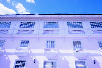 Low angle view of building against blue sky