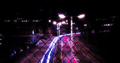 Illuminated ferris wheel at night