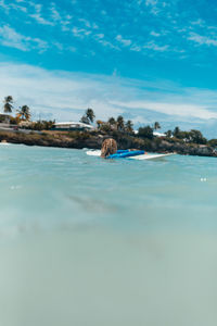 Surface level view of person surfing in sea