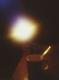 Close-up of lit candles on table