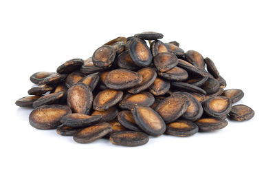 Close-up of coffee beans against white background