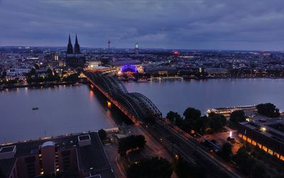 Aerial view of illuminated city buildings at dusk