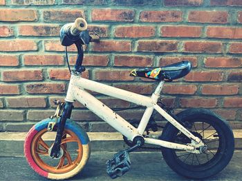 Bicycle against brick wall