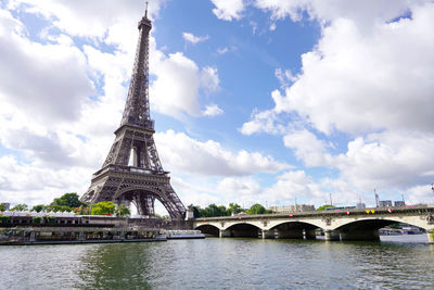 The eiffel tower and pont d'iena bridge on the seine in paris, france