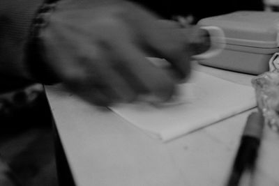 High angle view of woman holding paper