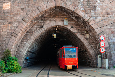 Red tram goes into the tunnel,  transportation in the capital