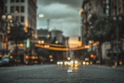 Close-up of wet illuminated city during rainy season