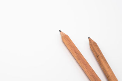 Close-up of colored pencils against white background