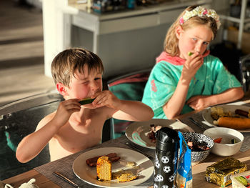 Mother playing with food at home