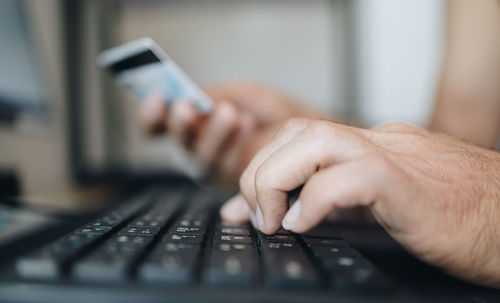 Close-up of man using mobile phone